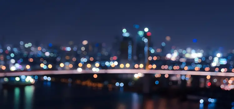 A blurred photograph of a cityscape